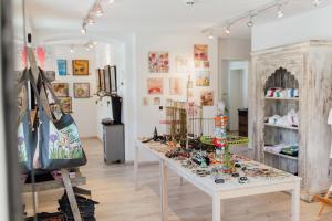 a room with a table with many items on it at Cubo Sport & Art Hotel in Sankt Johann in Tirol