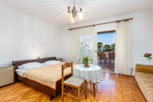 Posteľ alebo postele v izbe v ubytovaní Rona Apartments Ani