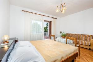 Posteľ alebo postele v izbe v ubytovaní Rona Apartments Ani