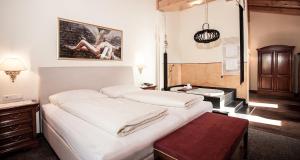 Postel nebo postele na pokoji v ubytování Hotel Gramaser