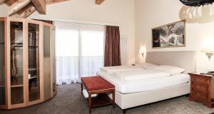 Postel nebo postele na pokoji v ubytování Hotel Gramaser