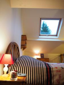En eller flere senge i et værelse på La Petite Chartreuse