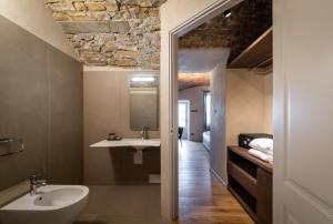 a bathroom with a sink and a mirror at Relais San Vigilio al Castello in Bergamo +70 photos