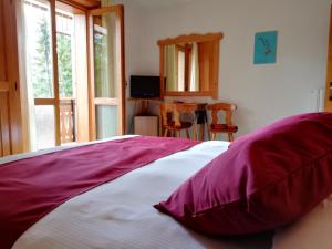 Postel nebo postele na pokoji v ubytování Hotel il Cardo