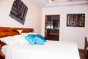 Rúm í herbergi á Hotel-Boutique Patampa
