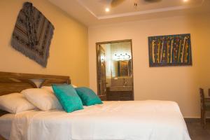 Rúm í herbergi á Hotel-Boutique Patampa