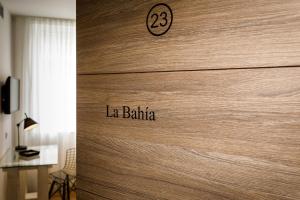 a wooden door with the words la balilla on it at Suite Home Pinares in Santander