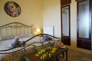 Postel nebo postele na pokoji v ubytování Masseria Le Terrazze di Serranova