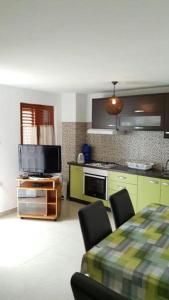 Kuchyň nebo kuchyňský kout v ubytování Apartments Andelic