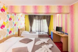 Postel nebo postele na pokoji v ubytování Hotel Central Point