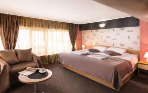 Postel nebo postele na pokoji v ubytování Hotel Central Point
