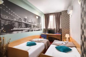 Postel nebo postele na pokoji v ubytování Hotel Central Point