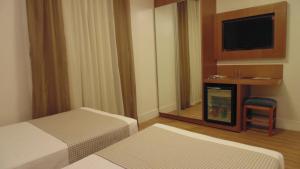 Voodi või voodid majutusasutuse Mirasol Copacabana Hotel toas