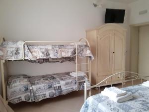 Postel nebo postele na pokoji v ubytování B&b Giadà