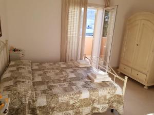 Postel nebo postele na pokoji v ubytování B&b Giadà