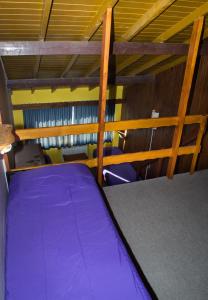 Postel nebo postele na pokoji v ubytování Marcopolo Inn Hostel Bariloche