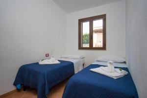 Postel nebo postele na pokoji v ubytování Cilento Dreams Village