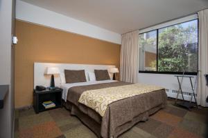 Posteľ alebo postele v izbe v ubytovaní Hotel Alborada
