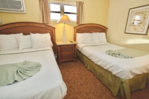 Postel nebo postele na pokoji v ubytování Quebec Motel