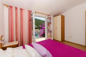 Postel nebo postele na pokoji v ubytování Apartments Dinko