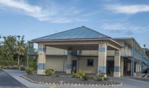 a large building with a roof on a street at Extended Stay - Ormond Beach in Ormond Beach