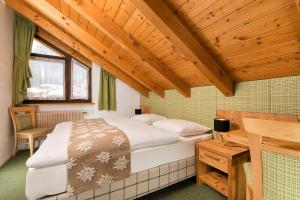 Postelja oz. postelje v sobi nastanitve Hotel Christian