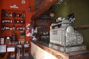 a bar with an old fashioned stove on the counter at Hotel Refugio Del Sol in La Quiaca +24 photos