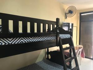 A bed or beds in a room at RV3 TRANSIENT HOUSE