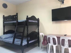 A bed or beds in a room at RV3 TRANSIENT HOUSE