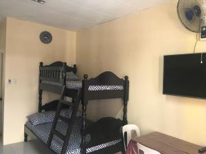 A bed or beds in a room at RV3 TRANSIENT HOUSE