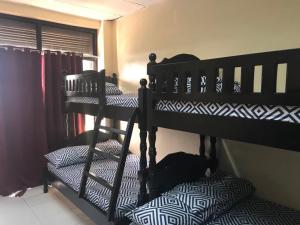 A bed or beds in a room at RV3 TRANSIENT HOUSE