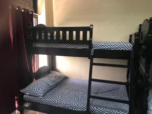 A bed or beds in a room at RV3 TRANSIENT HOUSE