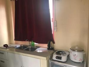 A kitchen or kitchenette at RV3 TRANSIENT HOUSE