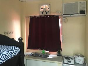 A kitchen or kitchenette at RV3 TRANSIENT HOUSE