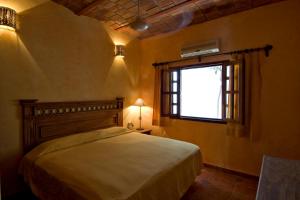 Postel nebo postele na pokoji v ubytování Hotelito Los Sueños