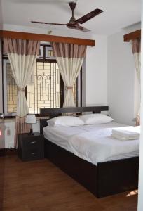 เตียงในห้องที่ Apartment in Nepal