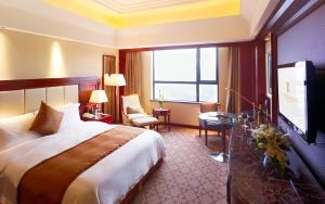 Katil atau katil-katil dalam bilik di Optics Valley Kingdom Plaza Wuhan