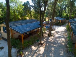an overhead view of a house with a blue roof at Mobile home - Kamp Olga in Banjole