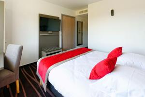 Postel nebo postele na pokoji v ubytování Hôtel AKENA Besançon