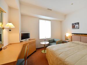 Postel nebo postele na pokoji v ubytování Hotel Crown Palais Kobe