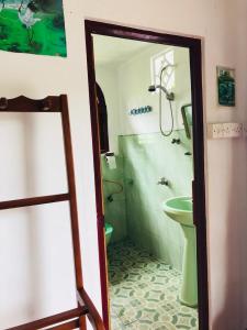 a bathroom with a shower and a toilet and a sink at Raj Villa Kumarakanda Hikkaduwa in Hikkaduwa