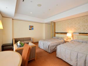 Postel nebo postele na pokoji v ubytování Hotel Crown Palais Kobe