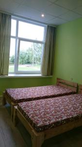 Cama ou camas em um quarto em Nakvynė Miroslave