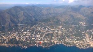 an aerial view of a city on top of a mountain at House Orizzonte - Casa Bianca in Genoa