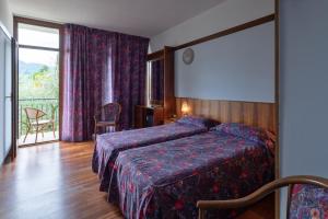 Postel nebo postele na pokoji v ubytování Park Hotel Oasi