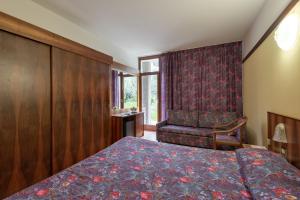 Postel nebo postele na pokoji v ubytování Park Hotel Oasi