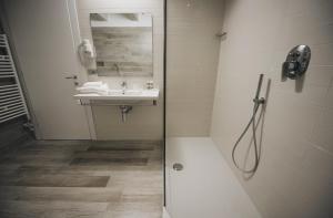 a bathroom with a shower and a sink at Cascina Speranza Hotel in Riva presso Chieri