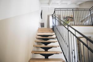 a staircase in a house with wooden steps at Cascina Speranza Hotel in Riva presso Chieri
