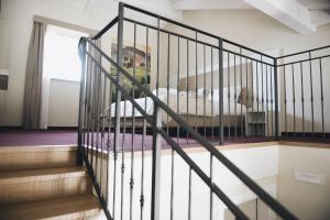 a staircase with a bed in a room at Cascina Speranza Hotel in Riva presso Chieri