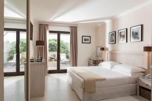 Кровать или кровати в номере Canne Bianche Lifestyle Hotel